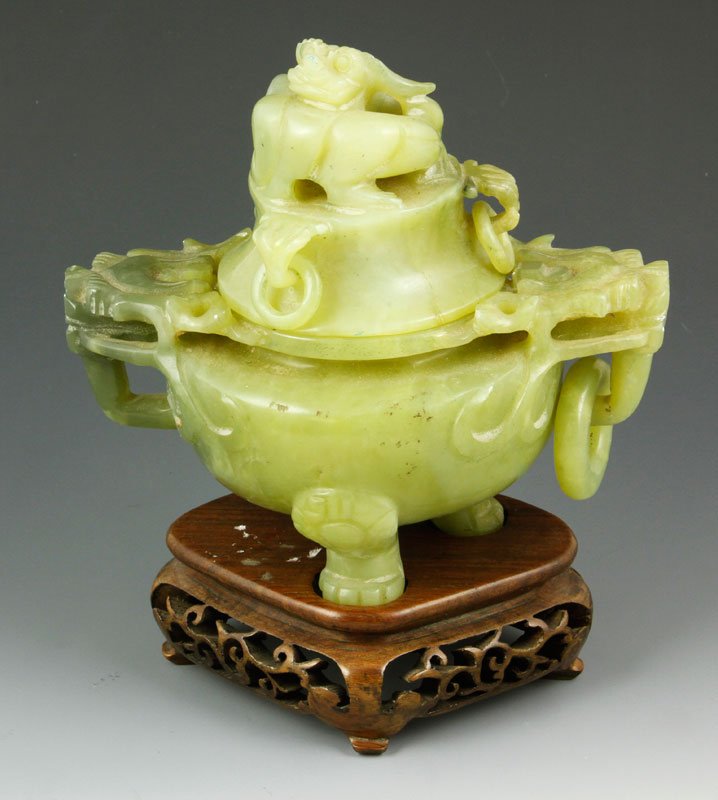 20th C. Chinese Carved Jade Censer: 20th century, Chinese, carved green jade censer, three foo lion shaped leg and two dragon head holder with round dragon cover, with original stand, 7"h x 53/4"w.