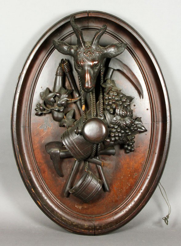 Carved Black Forest Plaque: Black Forest plaque, finely carved, with a ram's head. Minor loss.