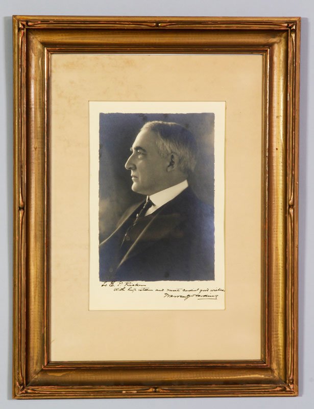 Autographed Warren G. Harding Photograph: Autographed Warren G. Harding photograph, taken at the Poland Spring, Maine resort, to Ephraim P. Richer, founder of Poland Spring Resort with original news story on back.