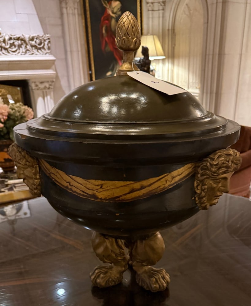 BLACK AND GILT URN WITH PINEAPPLE FINIAL: BLACK AND GILT URN, with pineapple finial, tiger paw feet and gilt swag 27" x 20"