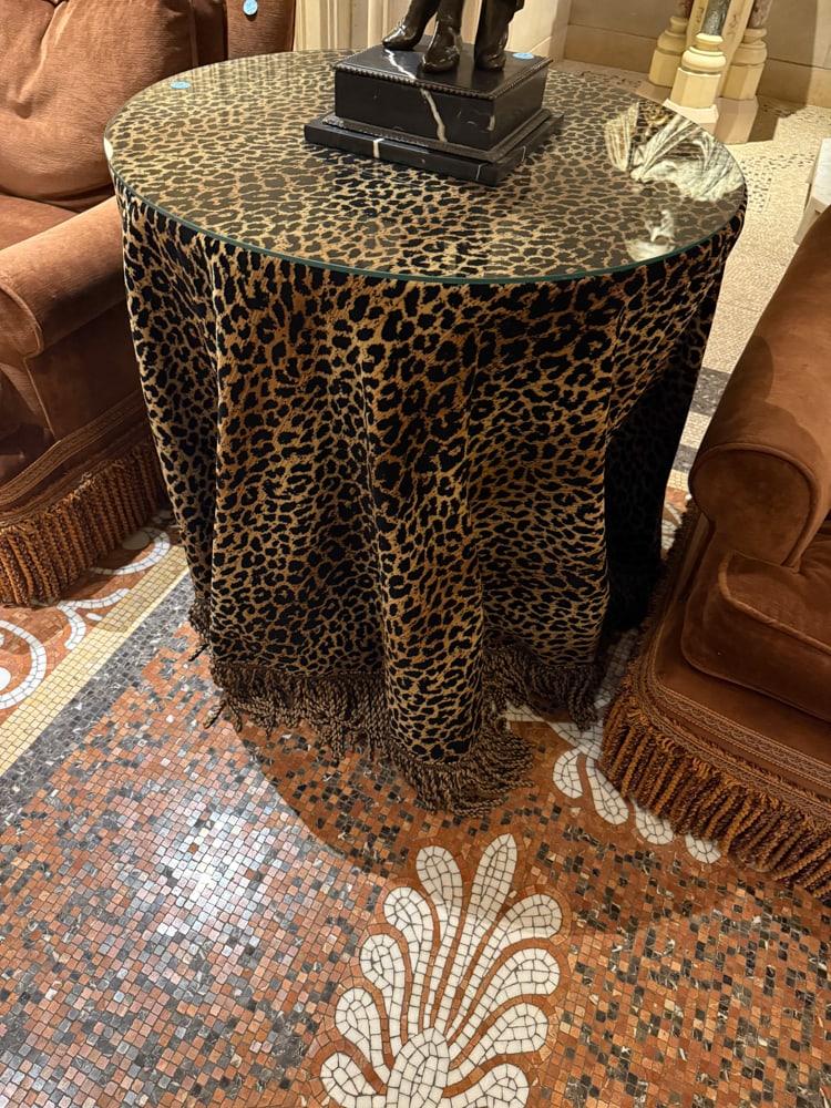 ROUND TABLE, LEOPARD FABRIC AND GLASS: ROUND TABLE 38" x 31" w/ Leopard fabric and glass
