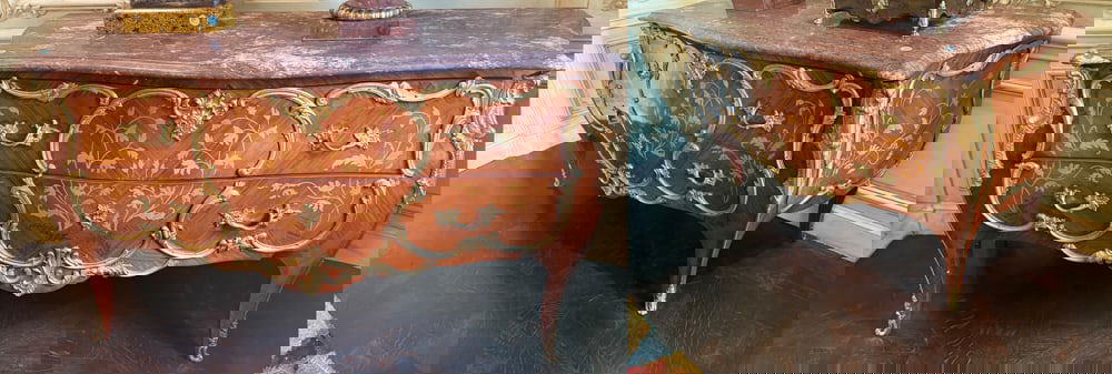 PAIR OF LOUIS XV STYLE KINGWOOD AND MARQUETRY COMMODES: A PAIR OF LOUIS XV STYLE ORMOLU MOUNTED KINGWOOD AND MARQUETRY COMMODES 20th century Each with a serpentine purple marble top above a bombe case fitted with two drawers, on cabriole legs, decorated ov