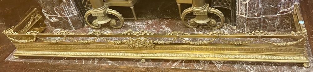 LOUIS XVI-STYLE FIREPLACE FENDER: LOUIS XVI-STYLE FIREPLACE FENDER - gilt floral and ribbon decorations, 8" H x 68" L x 12" D.