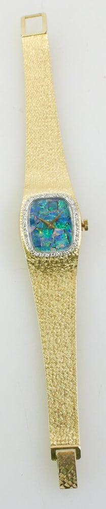 14k Yellow Gold, Diamond, and Opal Longines Watch: 14k yellow gold, diamond, and opal Longines watch, 7" L. Approximately 49.5 grams (including movement). Provenance: Littleton, Massachusetts collection. PLEASE NOTE: payment for silver, gold, jewelry,