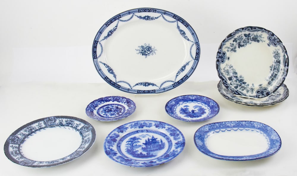 Group of Flow Blue Plates and Platters: Group of (9) flow blue plates and platters, circa 1882-1902, to include: platter, 16"; platter, 10"; (4) dinner plates, 11"; plate, 5"; plate, 7"; plate, 9". Provenance: Saugus, Massachusetts collecti