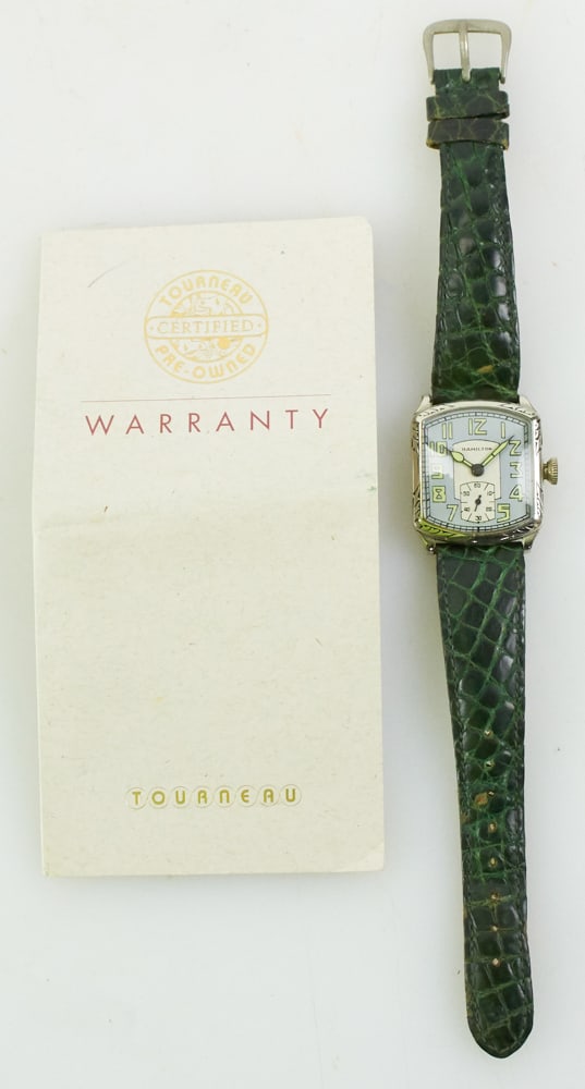 Hamilton Tourneau Steel Case Watch: Hamilton Tourneau wrist watch, steel case 1" x 1 1/8", 8 1/2" L. Includes Tourneau warranty. Provenance: Miami Beach, Florida collection. PLEASE NOTE: payment for silver, gold, jewelry, and coins must