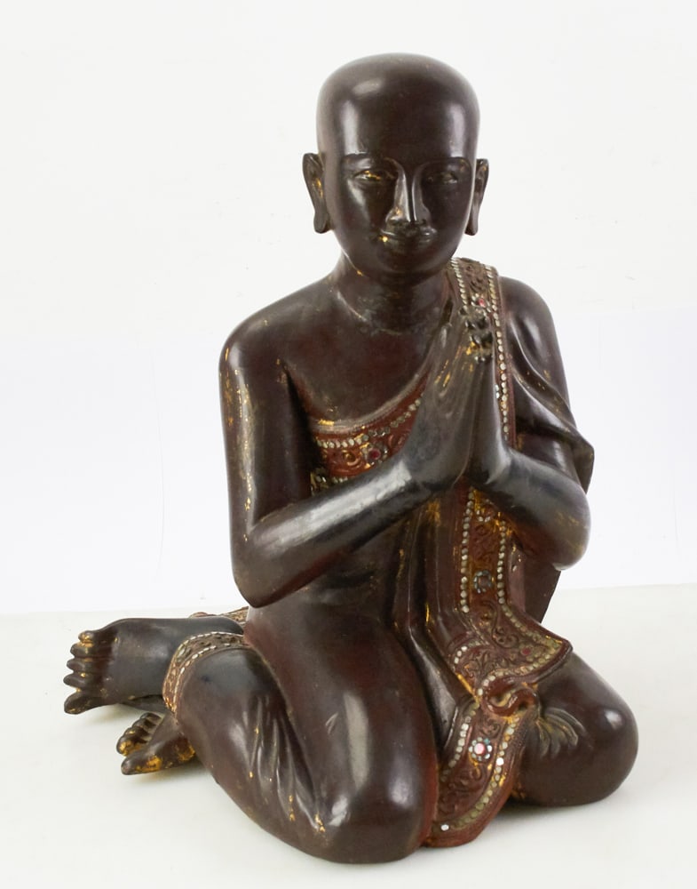 Burmese Monk Moggallana Kneeling in Prayer: Mandalay period, 18th/19th centuries, Burmese monk Moggallana, one of Buddha's disciples, depicted kneeling in prayer, in a pose with hands in the Naskara mudra showing reverence. Solid hand-carved wo