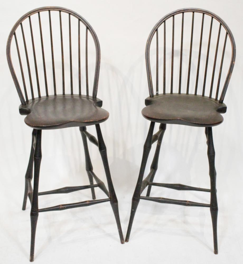 Pair of Hand-Crafted Tall Stools by David T. Smith: Pair of painted black hand-crafted tall stools, hoop backs, saddle seats, marked verso David T. Smith and Company, Cabinet Makers, Morrow, Ohio, 46 1/2" H x 19" W overall. Some paint wear. Provenance: