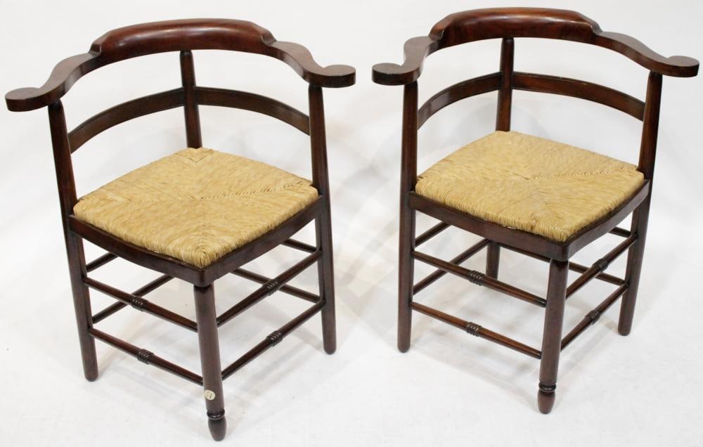 Pair of Mahogany Corner Chairs with Rush Seats: Pair of mahogany corner chairs, rush seats, 31" H x 18" x 18". Good condition. Provenance: Estate of Dalia Zikas, Melrose, Massachusetts.