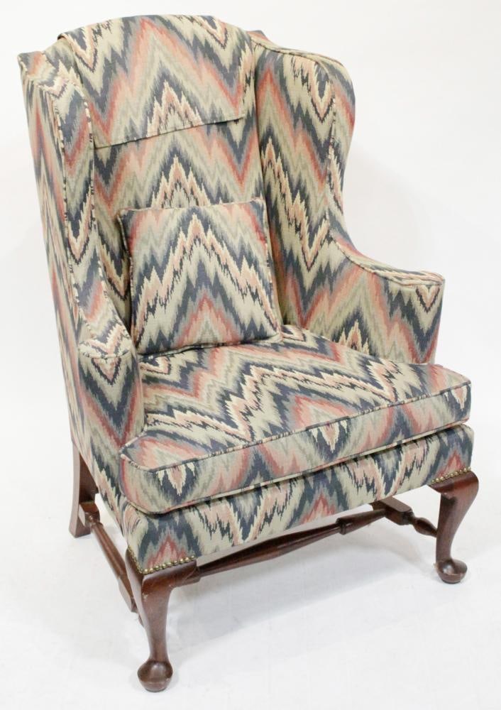 Mahogany Queen Anne Style Wing-back Chair: Mahogany Queen Anne style wing-back chair, newer flame motif upholstery, 49" H x 34" W x approximately 25" D. Good condition. Provenance: Estate of Dalia Zikas, Melrose, Massachusetts.