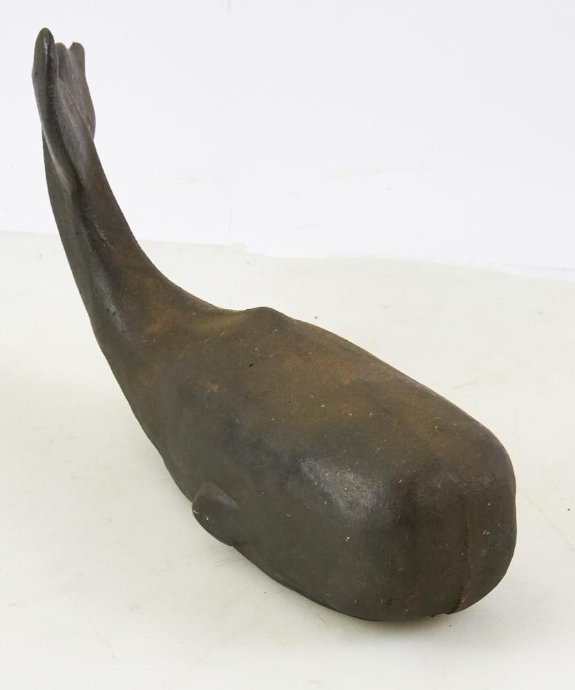 Cast Iron Figural Whale Doorstop: Cast iron figural whale doorstop, 7" H x 13" L. Good condition. Provenance: Estate of Dalia Zikas, Melrose, Massachusetts.