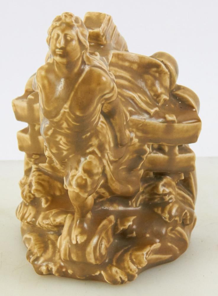 Rookwood Pottery Bookend Depicting Ship's Figurehead: Rookwood Pottery bookend depicting ship's figurehead, Rookwood flame mark "XXVI, 2732", 7 1/4" H x 4 1/4" W. Good condition. Provenance: Estate of Dalia Zikas, Melrose, Massachusetts.