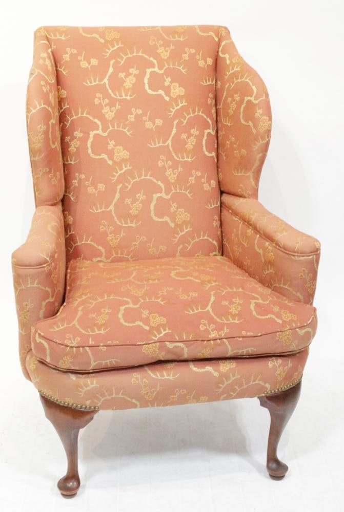 Queen Anne Styl Mahogany Upholstered Wingback Chair: Queen Anne style mahogany upholstered wingback chair, 44" H x 32" W x approximately 28" D. Good condition; some fading only. Provenance: Estate of Dalia Zikas, Melrose, Massachusetts.
