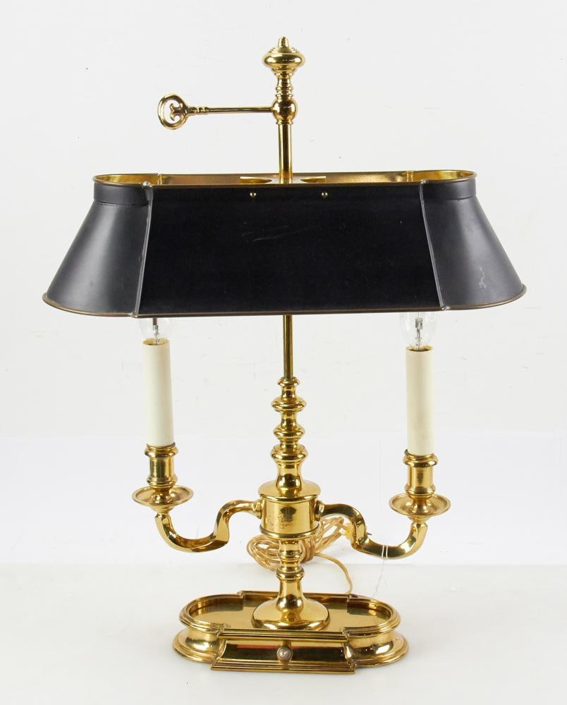Bouillotte-style Lamp with Black Tole Shade: Bouillotte-style lamp with black tole shade, 23 1/2" H x 17 1/2" W. Good condition. Provenance: Estate of Dalia Zikas, Melrose, Massachusetts.