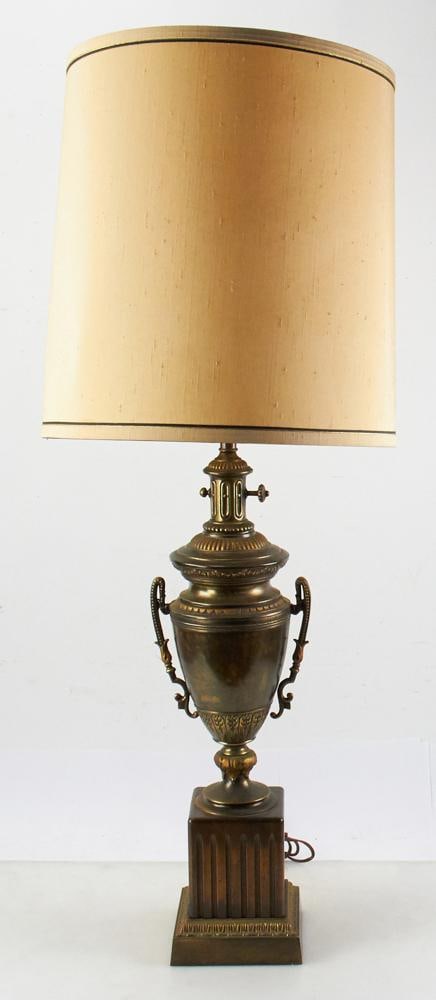 Decorative Frederick Cooper Urn-style Lamp: Decorative Federick Cooper finished metal urn-style lamp on wooden base, 40" H to top of shade x 6" square base. Good condition. Provenance: Estate of Dalia Zikas, Melrose, Massachusetts.