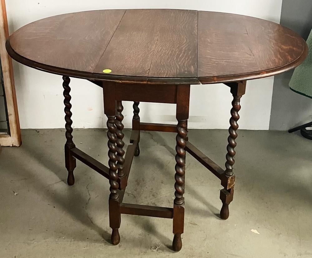 Oak Gate-leg Table with Barley Twist Legs: Oak gate-leg table, barley twist legs, 28 1/2" H x 29" W x 13 1/2" D. Good condition, with slight separation of top boards. Provenance: Estate of Dalia Zikas, Melrose, Massachusetts.