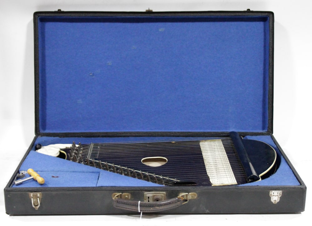 Vintage German Zither with Original Case: Vintage German zither, (24) strings, original fitted hard shell case, 24 3/4" x 13" x 1 1/8" thick. Good condition. Provenance: Estate of Dalia Zikas, Melrose, Massachusetts.