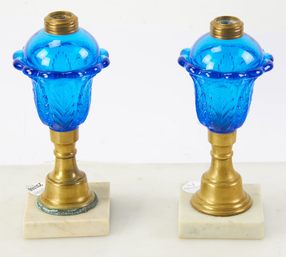 Pair of "Acanthus" Whale Oil Lamps: Pair of "acanthus" whale oil lamps attributed to Boston and Sandwich Glass Co., 8 3/4" H. Good condition. Provenance: Estate of Dalia Zikas, Melrose, Massachusetts.