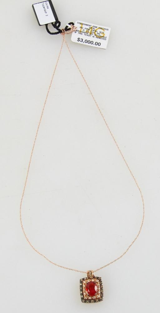 14k Rose Gold, Fire Opal, and Diamond Pendant and Chain: 14k rose gold, fire opal, and diamond pendant on 14k rose gold chain, marked LeVian, pendant 5/8" x 1/2", chain 17" L. Approximately 4.1 grams TW. Provenance: Gloucester, Massachusetts collection.
