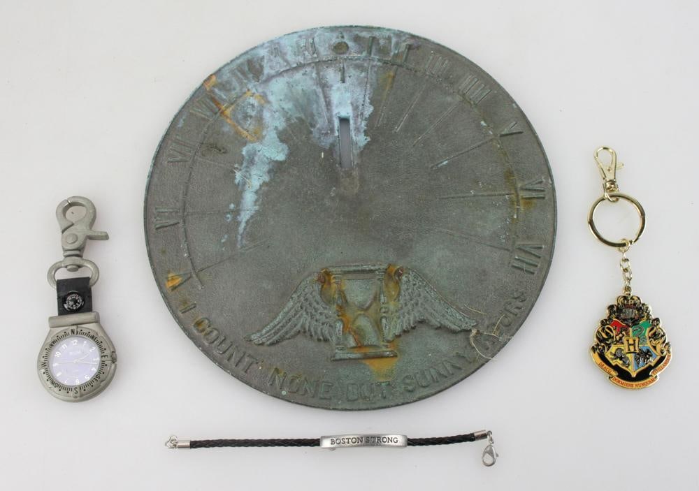 B.V.M. Lock, Bronze Sundial, Boston Strong, Harry Potter Key Chain: B.V.M. lock, bronze sundial, Boston Strong, Harry Potter key chain, (4) items total.