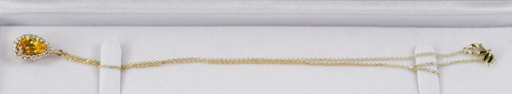 14k Yellow Gold, Yellow Sapphire and Diamond Necklace: Yellow sapphire and diamond pendant in 14k yellow gold setting with 14k yellow gold chain 16" L. Pear shape golden orange yellow sapphire 7.50 x 11.43 x 5.60mm, approximately 3.30 cts; (20) round bril
