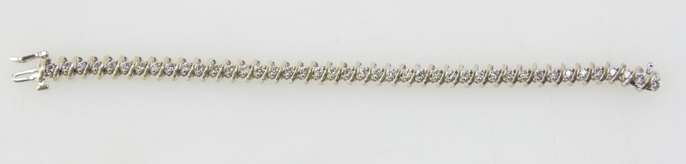 14k White Gold and Diamond Bracelet: 14k white gold and diamond bracelet, (42) round diamonds, approximately 2.6 ctw, 7" L. Approximately 16.7 grams TW. Provenance: Palm Beach, Florida estate. PLEASE NOTE: payment for silver, gold, jewel
