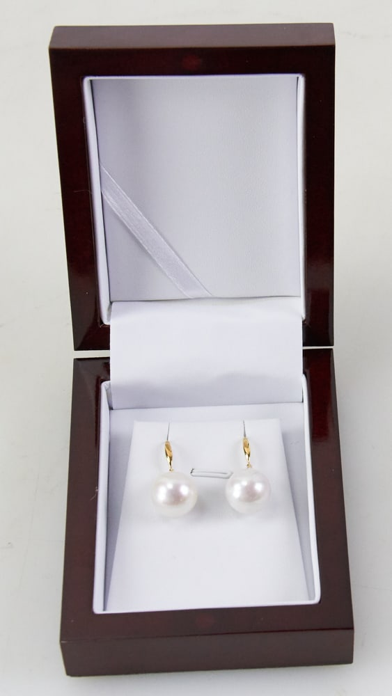 South Sea Pearl Earrings with 18k Gold Diamond Mounts: South Sea pearl earrings having 18k gold and diamond mounts, pearls 14mm. Provenance: Honolulu, Hawaii collection. PLEASE NOTE: payment for silver, gold, jewelry, and coins must be made via wire trans