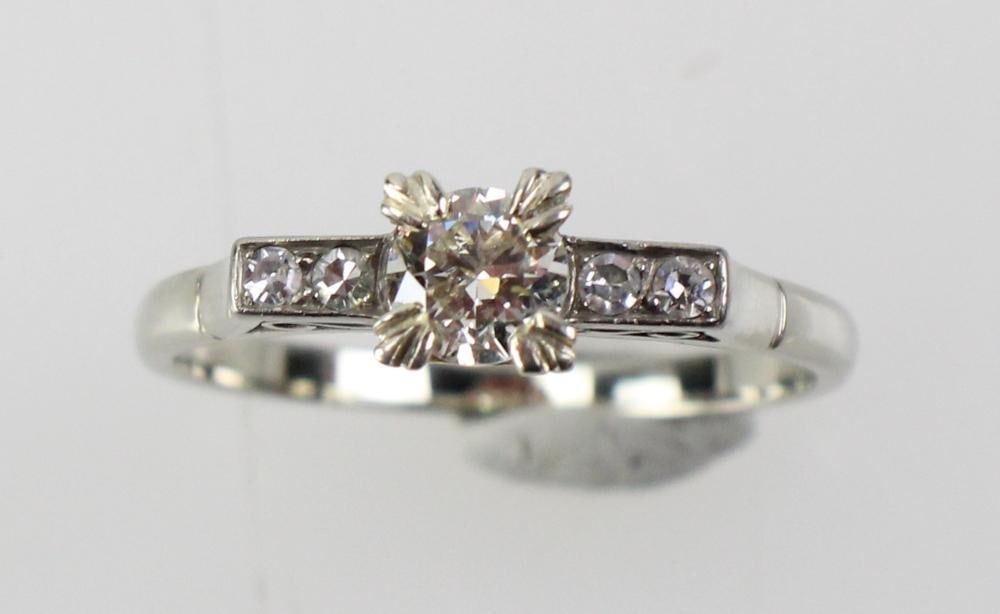 14k White Gold and Diamond Ring: 14k white gold and diamond ring, size 8 3/4. Approximately 2.8 grams TW. Provenance: Stoneham, Massachusetts collection. PLEASE NOTE: payment for silver, gold, jewelry, and coins must be made via wire