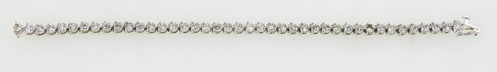 14k Gold and Diamond Tennis Bracelet: 14k gold and diamond tennis bracelet, 7" L. Approximately 8.53 dwt, 13.25 grams. Provenance: Palm Beach, Florida estate. PLEASE NOTE: payment for silver, gold, jewelry, and coins must be made via wire