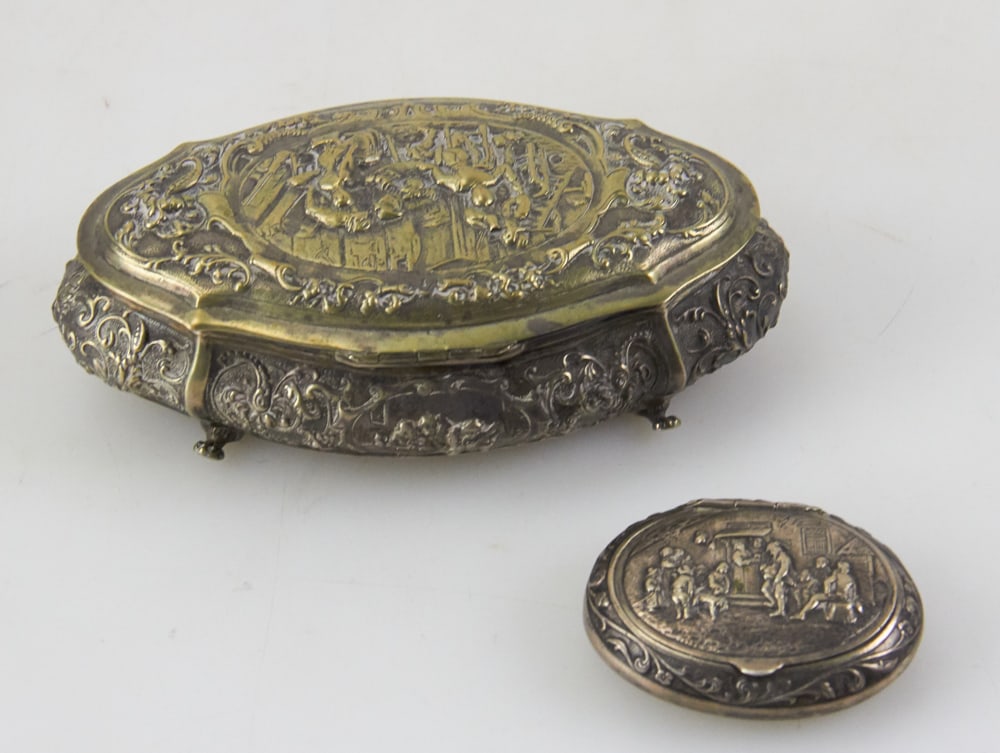 Two 19thC Dutch .833 Silver Ornate Boxes: Two 19th century Dutch .833 silver ornate boxes, larger 2" H x 6" W x 3 1/2" D. Approximately 8.8 troy oz TW. Provenance: South Hamilton, Massachusetts collection. PLEASE NOTE: payment for silver, gol
