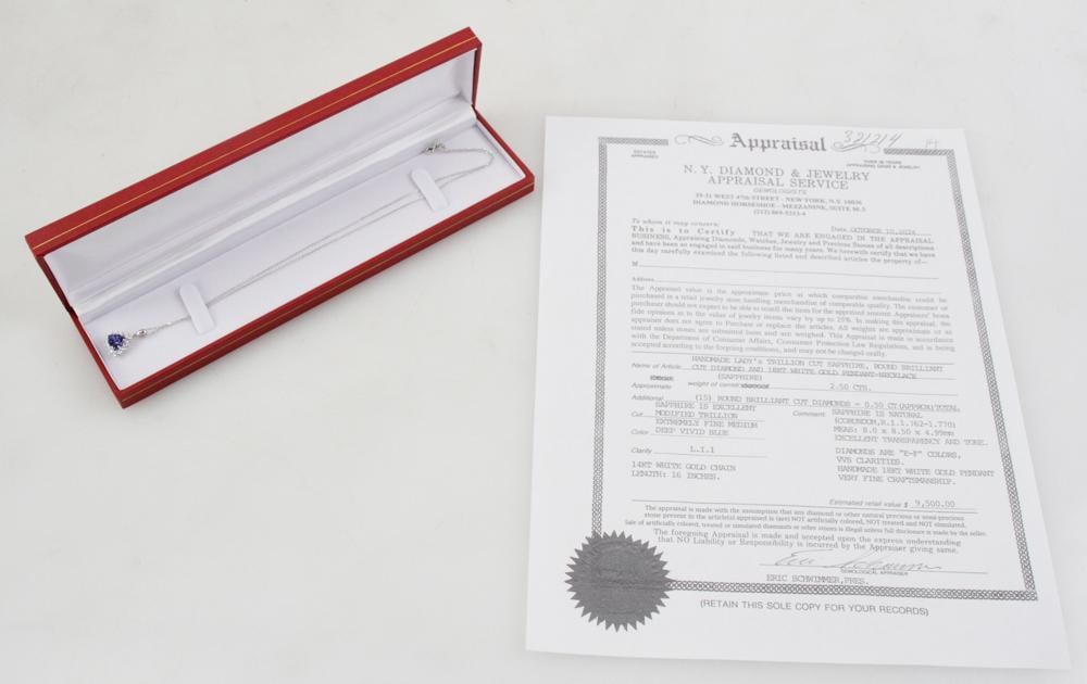 18k/14k Gold, Blue Sapphire and Diamond Necklace: Blue sapphire and diamond pendant in 18k white gold with 14k white gold chain 16" L. Trillion cut Ceylon sapphire with excellent brilliance, approximately 2.50 cts; (15) round brilliant cut diamonds,