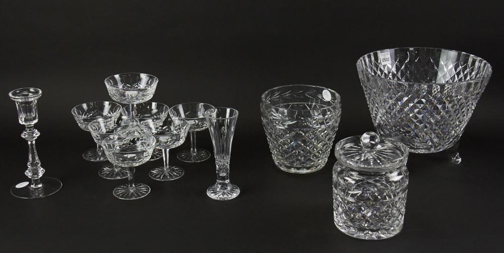 Waterford Crystal Bowls, Candlestick, Vase, Glasses, Jar: Waterford crystal, (12) pieces, to include: center bowl, 9" x 10" x 6"; candlestick, 8" H; bud vase, 6" H, (7) glasses, 4" H; covered jar, 7" H; bowl, 6" diameter. Provenance: Cambridge, Massachusetts