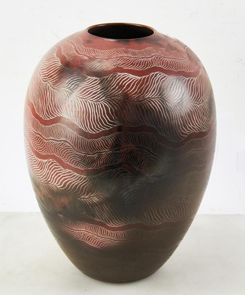 Nancee Meeker Raku Pottery Vase: Nancee Meeker Raku pottery vase with incised decoration, 13" H x approximately 9" diameter. Good condition. Meeker's pieces are in the Smithsonian Museum. Provenance: Estate of Dalia Zikas, Melrose, M