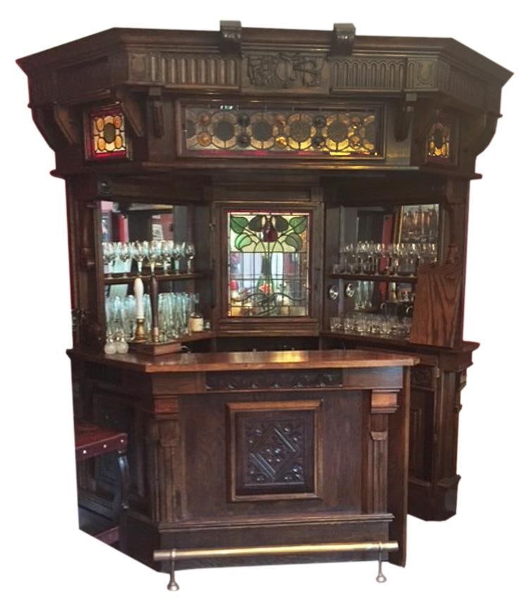 Antique-style English Bar with Stained Glass Panels, Back-lit: Antique-style English bar, having stained glass panels, back-lit. NOTE: NEEDS REPAIR. Original purchased for $15,000. Provenance: Salem, Massachusetts collection. PLEASE NOTE: On KaminskiLIVE, lo