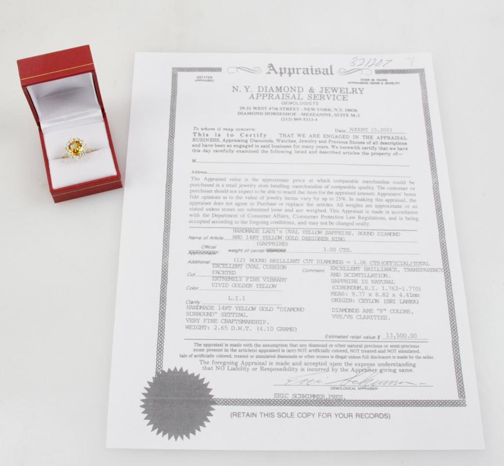 14k Yellow Gold, Yellow Sapphire and Diamond Ring: Yellow sapphire and diamond ring in 14k yellow gold. Oval yellow sapphire with vivid golden yellow, approximately 3.0 cts; (12) round brilliant cut diamonds, approximately 1.06 ctw, E-F color, VVS/VS