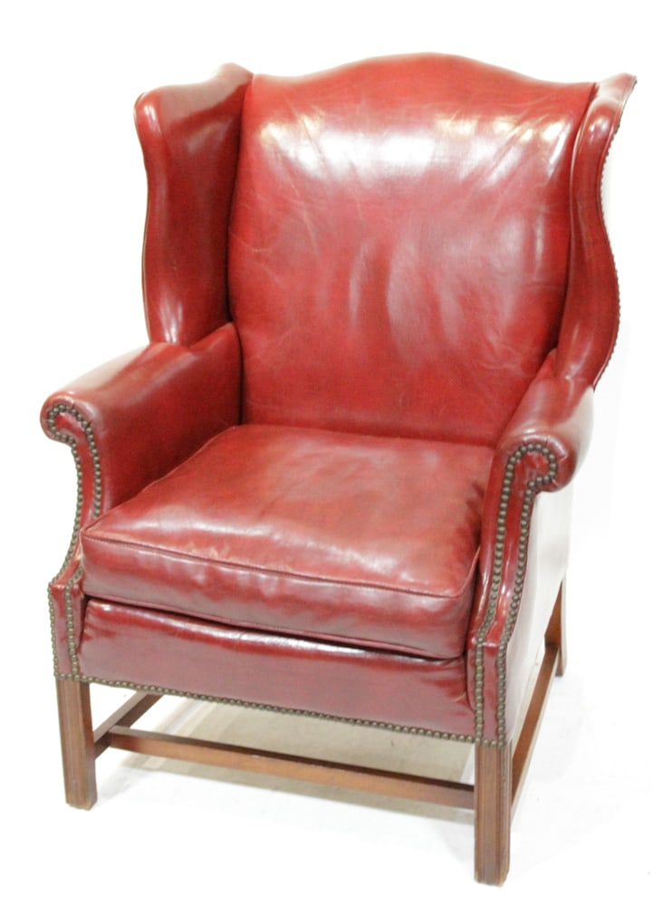 Burgundy Red Leather Wing-back Chair: Burgundy red leather wing-back chair, 40" x 42" x 35". Provenance: West Palm Beach, Florida collection.