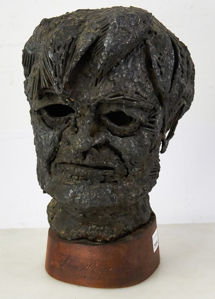John W. Kearney, Metal Sculpture of Man's Head: John W. Kearney (American, 1924-2014), metal sculpture of man's head, signed and dated 62 on base, 15" H. Good condition. Provenance: Estate of Dalia Zikas of Melrose, Massachusetts.