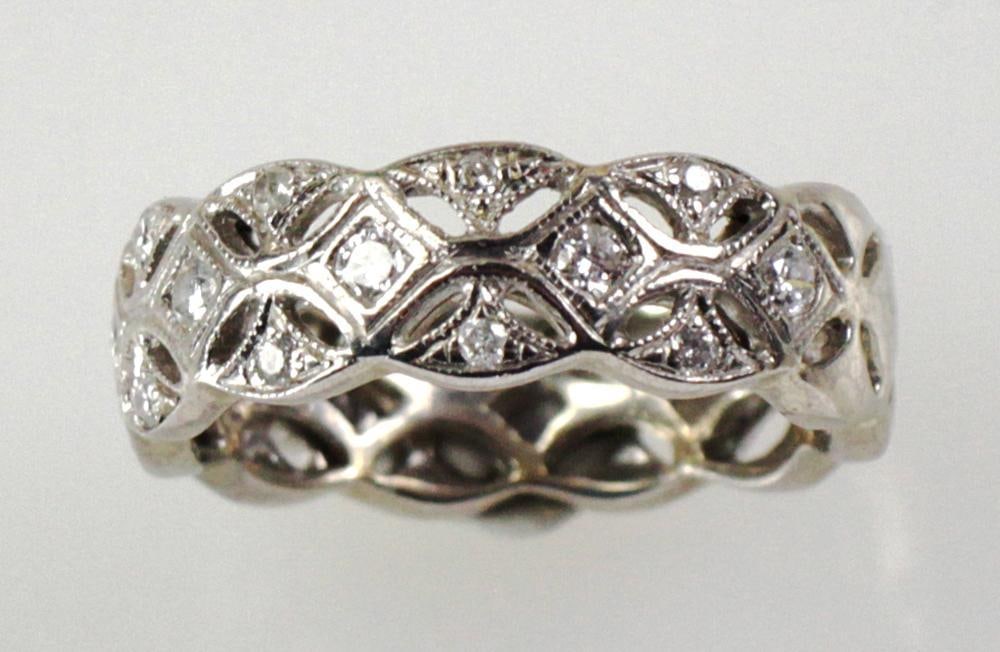 14k White Gold and Diamond Band: 14k white gold and diamond band, ring size 7. Approximately 5 grams TW. Provenance: Gloucester, Massachusetts collection. PLEASE NOTE: payment for silver, gold, jewelry, and coins must be made via wir