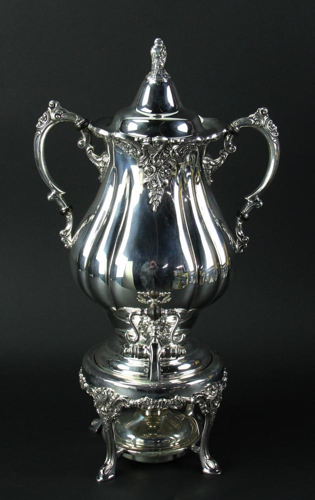 Wallace "Grand Baroque" Sterling Coffee Urn: Wallace "Grand Baroque" sterling coffee urn with burner. Approximately 156.0 troy oz TW. Note: Due to scale capacity, urn was weighed in pounds (10.7) on floor scale, then converted to troy ounces. Pr