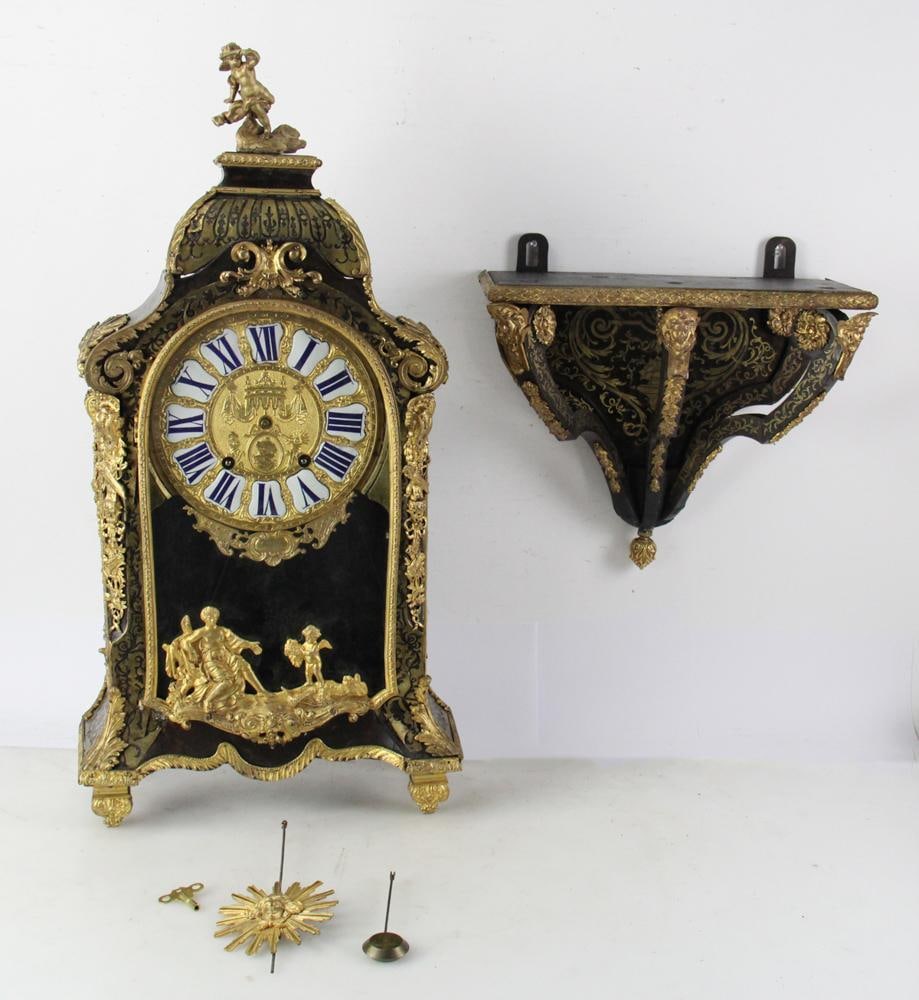 C1720 French Large Boulle Bracket Wall Clock: Circa 1720 French large boulle bracket wall clock, known maker, period, ebony wood with brass lacy inlay, clock 32" H, 12" 3-arm bracket. Provenance: From the 50-year personal collection of Mr. John