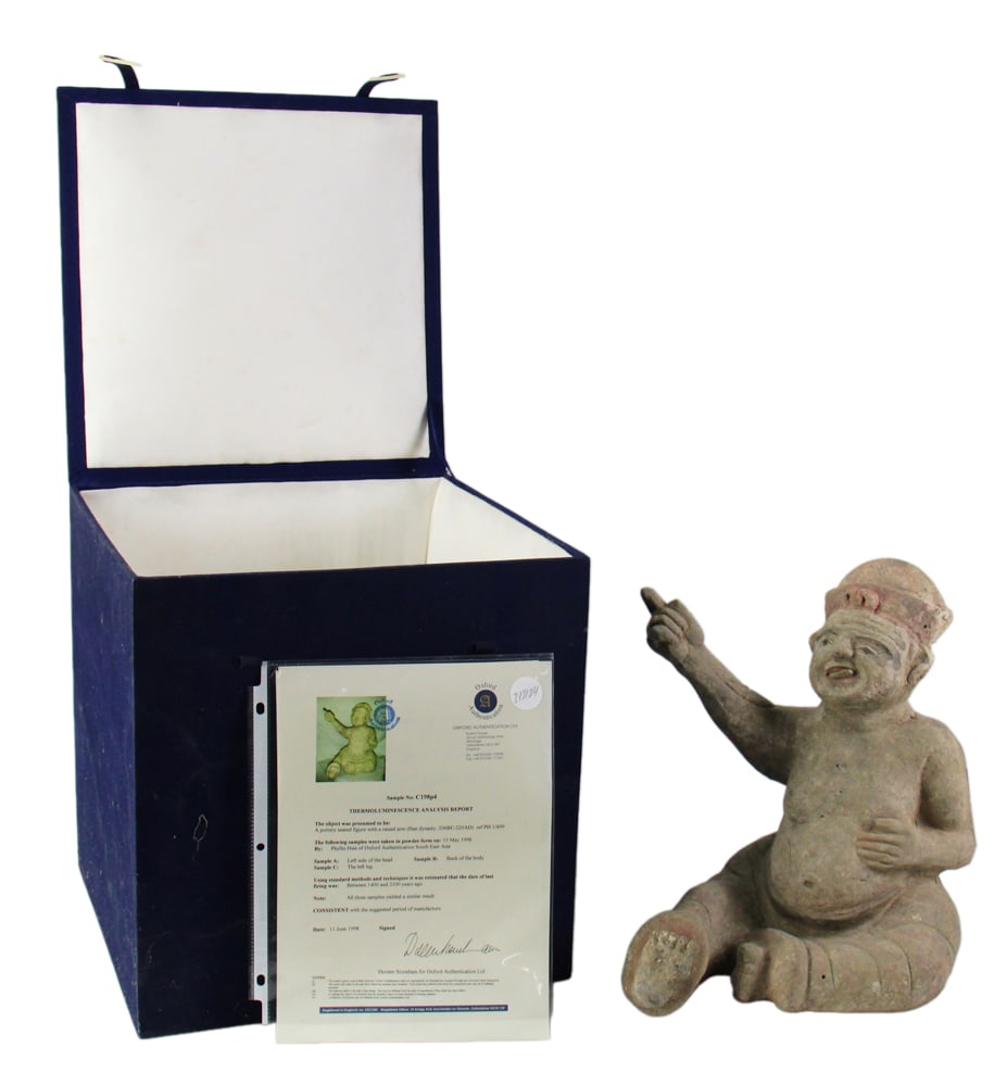 Chinese Han Dynasty Pottery Seated Figure: Chinese Han Dynasty pottery seated figure with a raised arm, 14" x 11" x 12 1/2". Oxford Authentication Certificate. Provenance: Private collector from Rotterdam / Weston, Massachusetts.