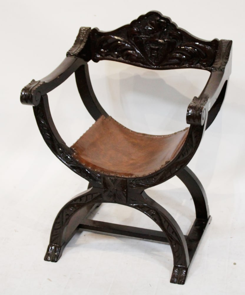 Vintage Italian Renaissance Style Savonarola Chair: Vintage Italian Renaissance style Savonarola chair with leather curved "saddle-seat", curved shape, carved back rest. Provenance: From the 50-year personal collection of Mr. John Hvozda of Hermitage,