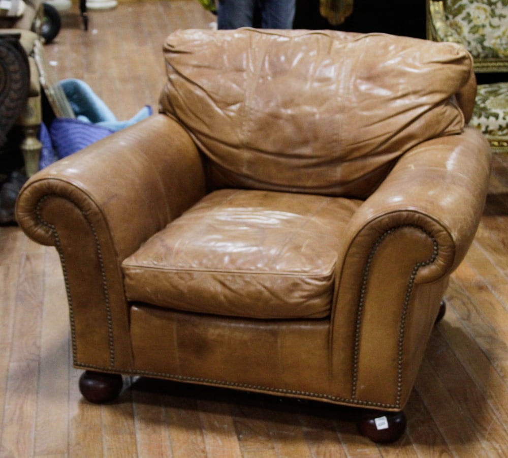 Butterscotch Leather Club Chair with Bun Feet: Butterscotch leather club chair with bun feet, 32" H x 37" W x 37" D. Provenance: From the 50-year personal collection of Mr. John Hvozda of Hermitage, Pennsylvania.