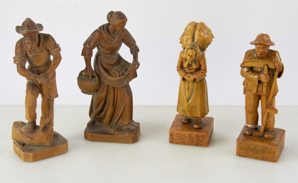 Two Pair of Carved Wood Couples: Two pair of carved wood couples, one depicting woman gathering and man chopping wood, the other depicting an elderly couple harvesting, tallest 10 3/4". All in good condition. Provenance: Estate of