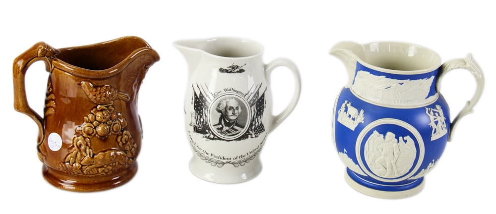 Group of Three English Jugs: Three English jugs, to include: the "Chicago Pitcher", Copeland Spode; Rockingham-glazed jug with hound handle; transfer-decorated "Free Trade and Sailor Rights" jug. Provenance: Estate of Dalia