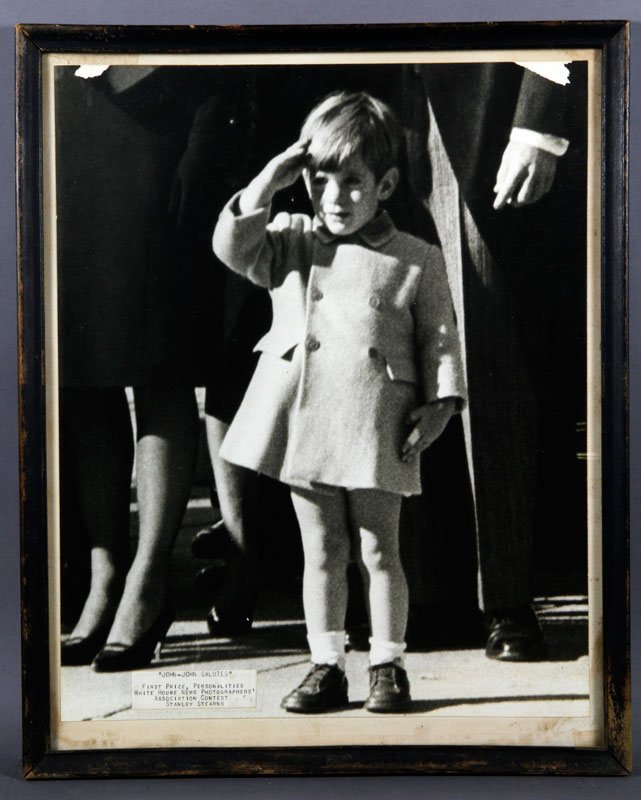 Stearns, John Kennedy Jr, Photograph: Stanley F. Stearns, John Kennedy Jr. saluting the coffin of his father as it was carried from St. Matthews Cathedral for burial in Arlington National cemetery, 11/25/63, this photograph made the front