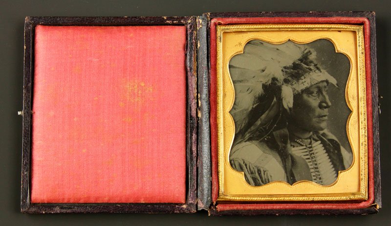 Ambrotype of Native American: Sixth plate ambrotype of a Native American wearing a headdress, 3 1/4" x 3 3/4"w.