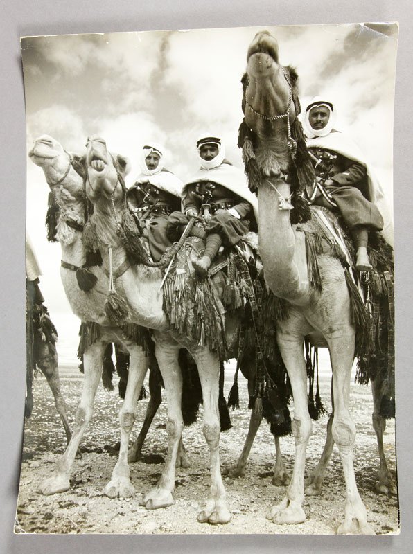 Bourke-White, Camel Corps at Dmeir, Gelatin Silver Prin: Margaret Bourke-White, Camel Corps at Dmeir, gelatin silver print, hand written note and stamped verso, circa 1940s, unframed, 10 6/8"h x 14 1/2"w. Creases to corners.