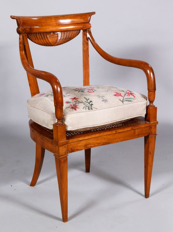 19th C. French Open Arm Chair: 19th century French open arm chair with shield crest, caned seat and formed needlework cushion, 34 1/2" h x 21 1/2" w x 21" d, height of seat with cushion 18 1/2" h.