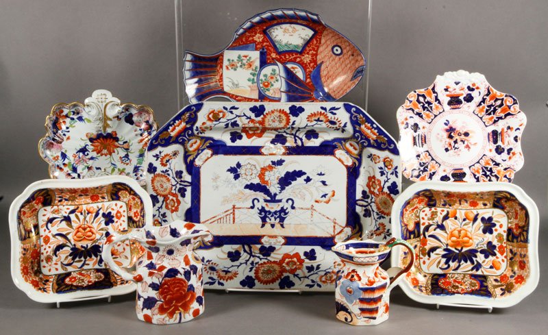 Lot of Imari Pattern Dish Wares: Lot of assorted Imari pattern dish wares, to include one 18 1/2" platter with stand; a fish platter; two bowls; two pitchers and two plates, eight pieces total, some English, some Japanese.